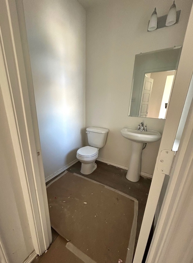 bathroom featuring sink and toilet