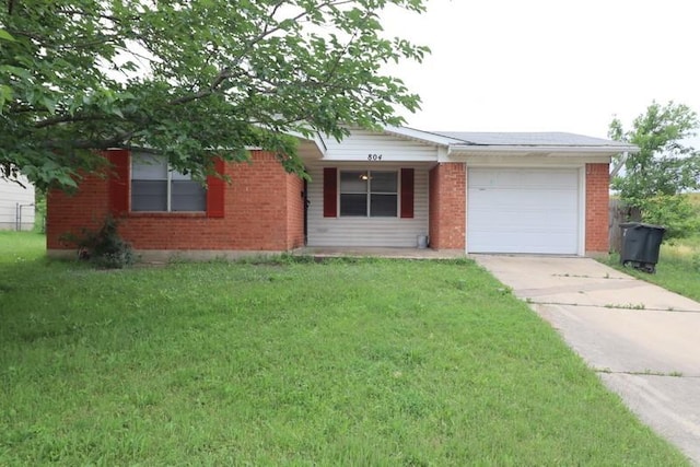 ranch-style house with a garage and a front yard