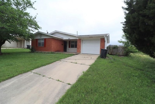 ranch-style home featuring a garage and a front lawn