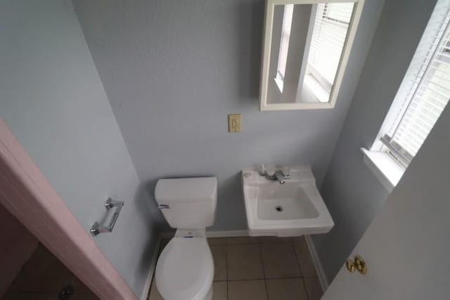 bathroom featuring tile patterned floors, sink, and toilet