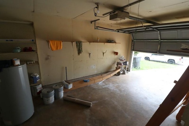 garage with a garage door opener and water heater