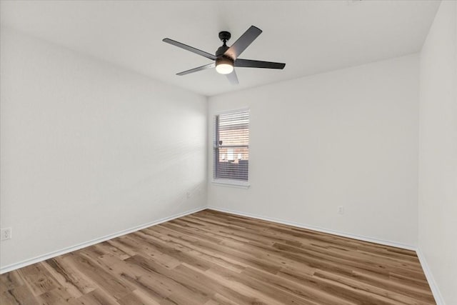 unfurnished room featuring light hardwood / wood-style flooring and ceiling fan