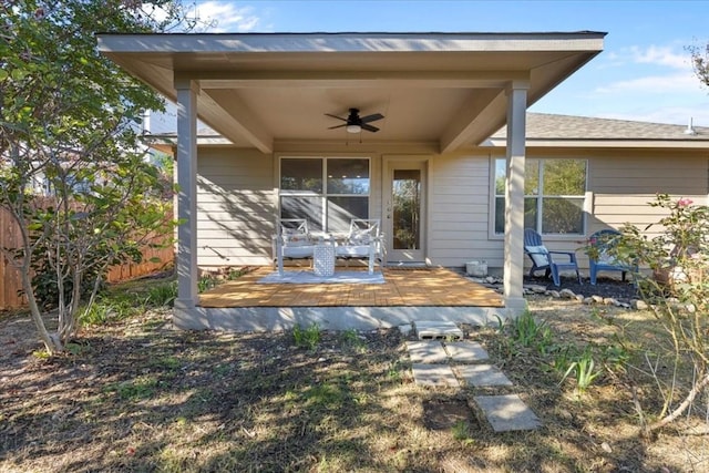 exterior space with a wooden deck and ceiling fan