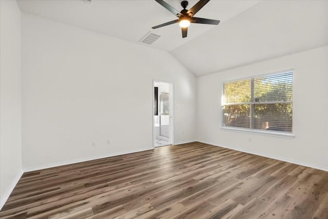 spare room with ceiling fan, dark hardwood / wood-style floors, and lofted ceiling