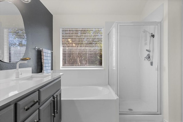 bathroom featuring vanity and separate shower and tub