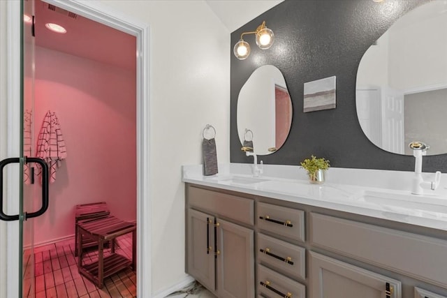 bathroom with tile patterned flooring and vanity