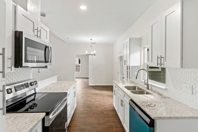 kitchen featuring stainless steel appliances, white cabinetry, dark hardwood / wood-style floors, and sink