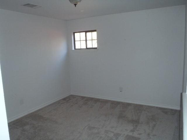 spare room with carpet floors