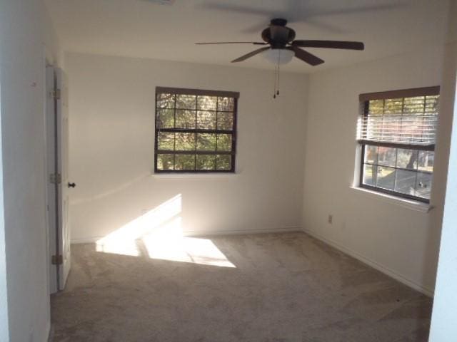 carpeted empty room with ceiling fan