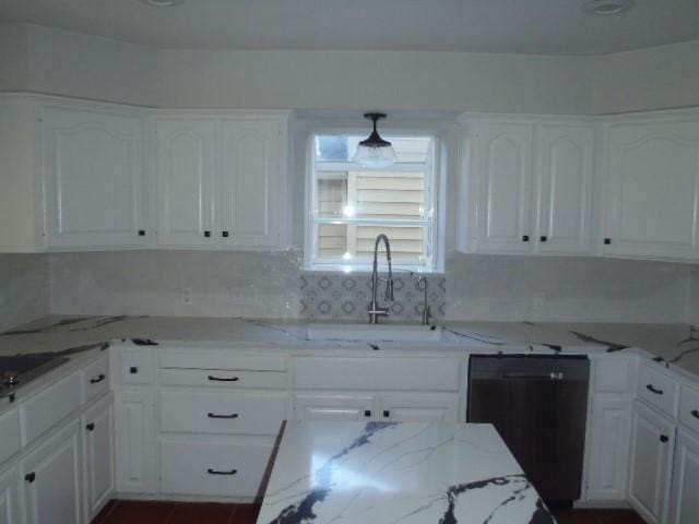 kitchen with white cabinets, dishwasher, light stone countertops, and sink