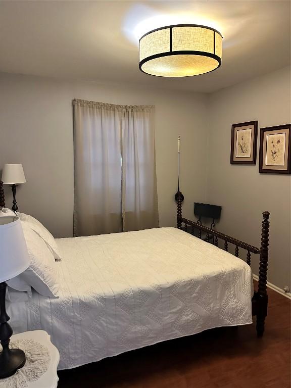 bedroom featuring wood-type flooring