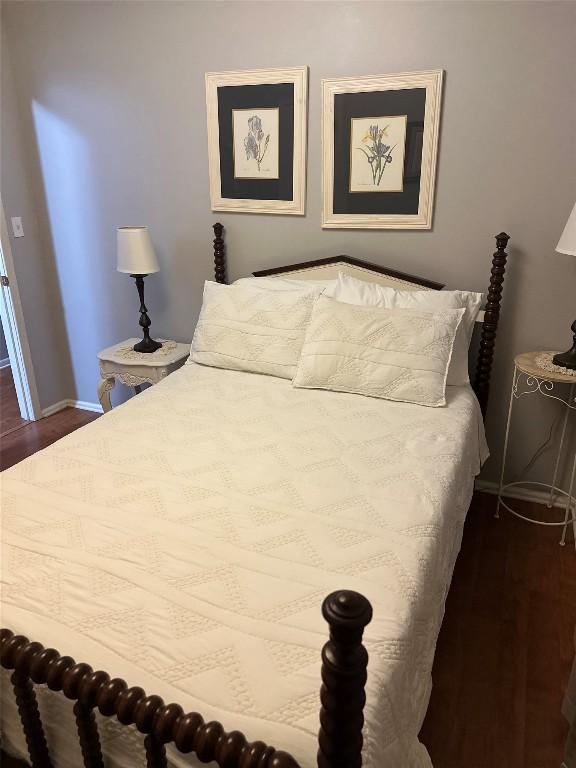 bedroom featuring dark hardwood / wood-style flooring