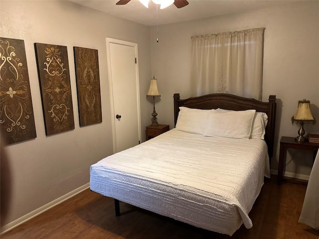 bedroom featuring ceiling fan and dark wood-type flooring