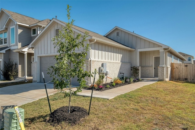 craftsman house with a garage and a front lawn