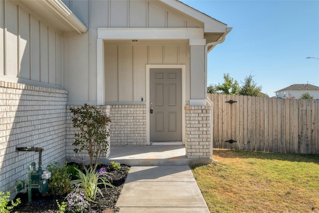 entrance to property with a yard