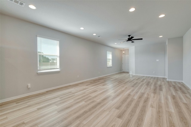 unfurnished room featuring ceiling fan and light hardwood / wood-style flooring