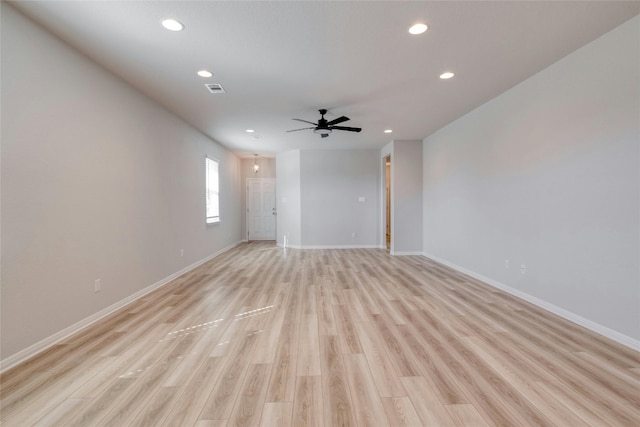 empty room featuring light wood-type flooring and ceiling fan