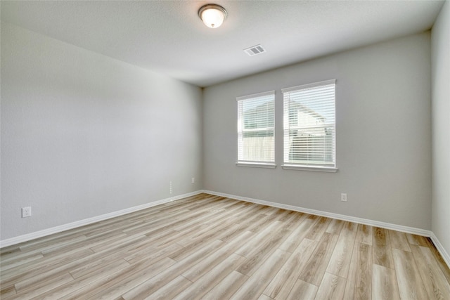 unfurnished room featuring light hardwood / wood-style flooring