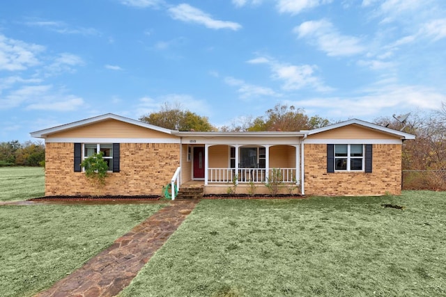 ranch-style home featuring a front yard and a porch