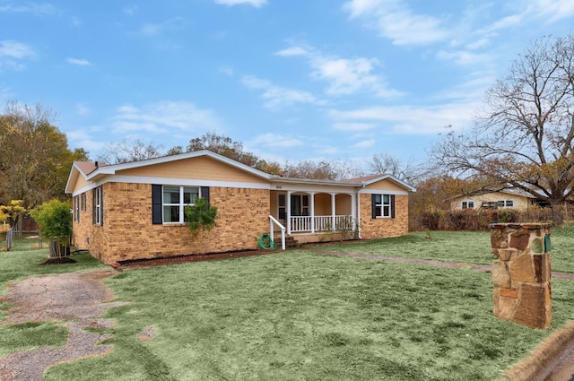 view of front of house with a porch and a front yard