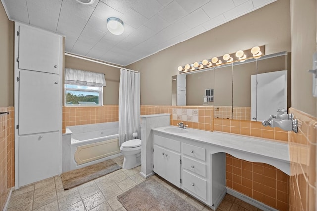 full bathroom with vanity, tile patterned flooring, toilet, tile walls, and shower / tub combo with curtain