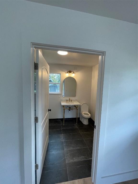 bathroom featuring toilet