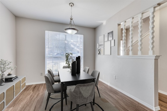 1815 River Crossing Cir Unit D, Austin, TX 78741 - dining room featuring wood finished floors and baseboards