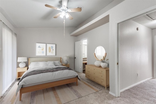 bedroom featuring light carpet, ceiling fan, baseboards, and vaulted ceiling