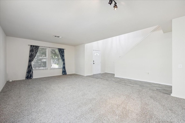 unfurnished living room with carpet floors