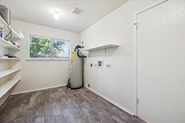 washroom with electric dryer hookup, water heater, dark hardwood / wood-style flooring, and washer hookup