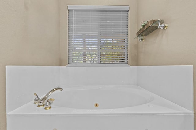 bathroom featuring a tub to relax in