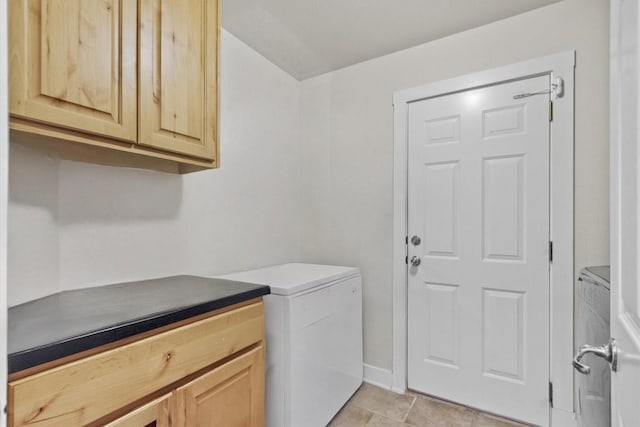 washroom with cabinets, light tile patterned floors, and separate washer and dryer