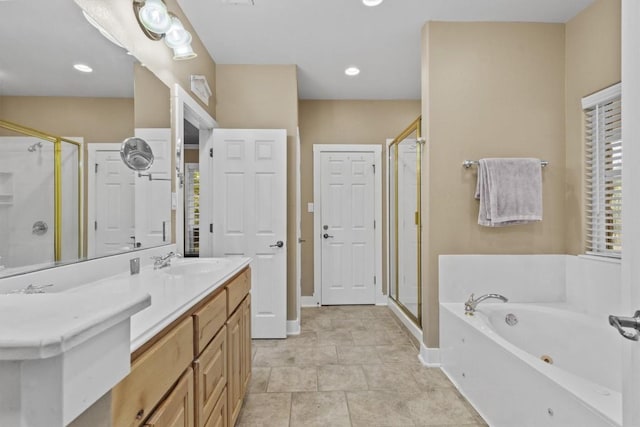 bathroom with vanity and independent shower and bath