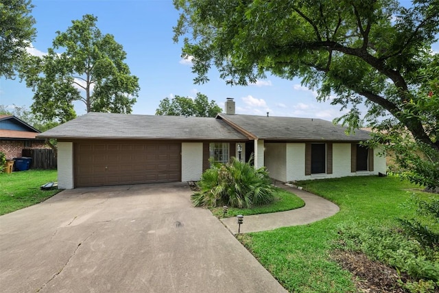 ranch-style house featuring a garage and a front yard