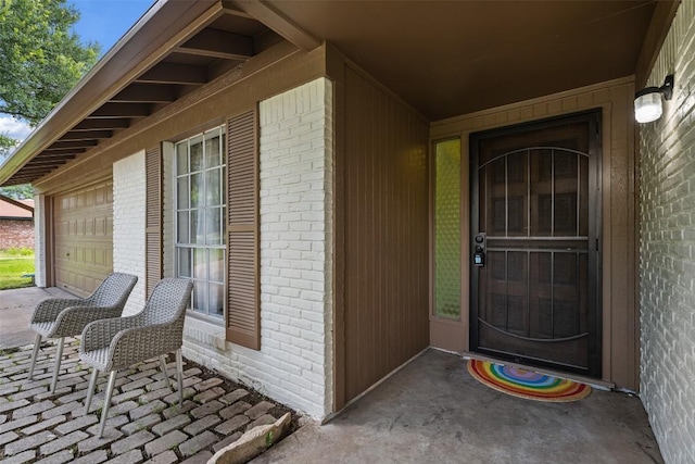 view of exterior entry featuring a garage