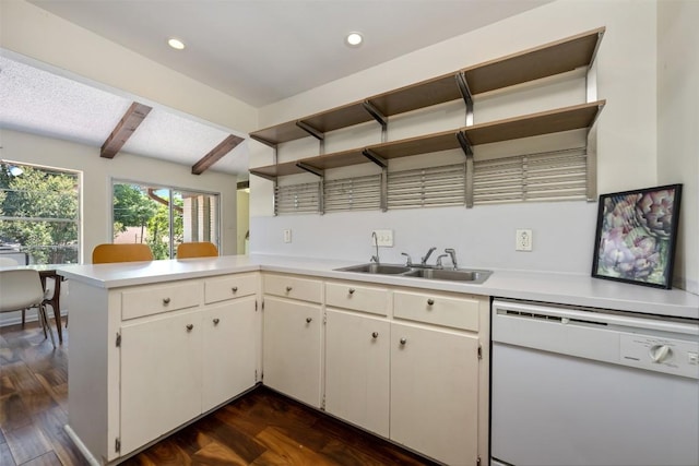 kitchen with beam ceiling, sink, dark hardwood / wood-style floors, kitchen peninsula, and white dishwasher