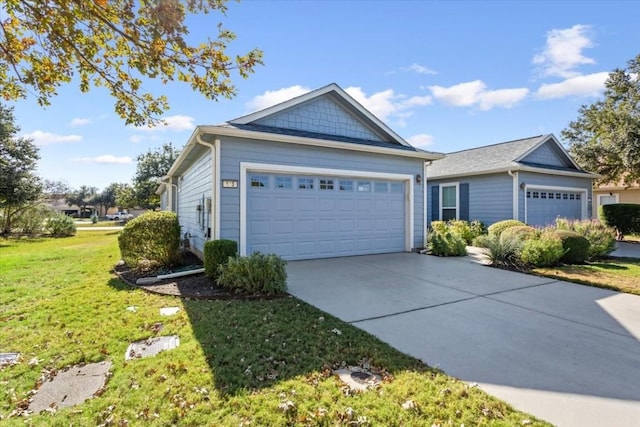 view of front of home featuring a front yard and a garage