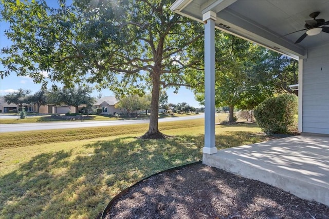 view of yard featuring ceiling fan