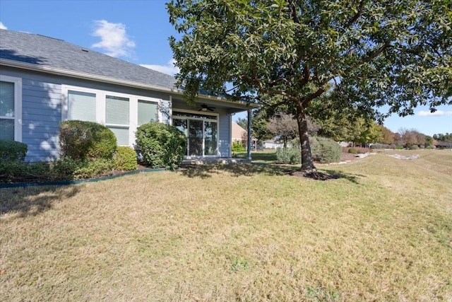 view of yard with ceiling fan