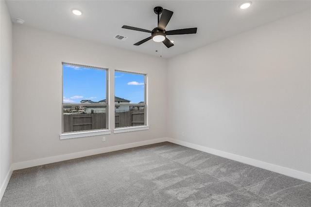 carpeted empty room with ceiling fan