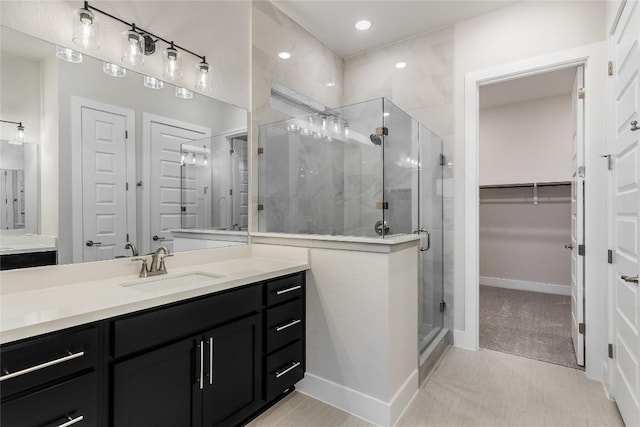 bathroom with vanity and an enclosed shower