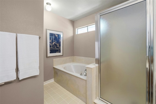 bathroom featuring tile patterned flooring and shower with separate bathtub