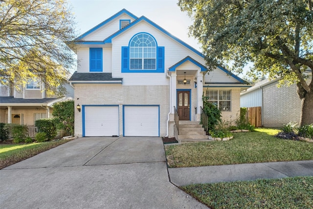 view of front of house featuring a front yard and a garage