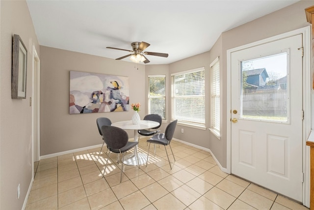 dining room with light tile patterned floors and ceiling fan