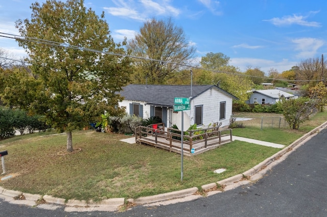 1718 Adina St, Austin, TX 78721 - view of front of property with a wooden deck and roof with shingles