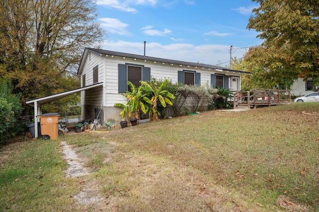 1718 Adina St, Austin, TX 78721 - back of property featuring a wooden deck and a yard