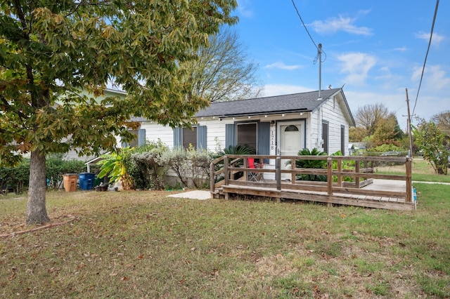 1718 Adina St, Austin, TX 78721 - ranch-style house featuring a deck and a front lawn