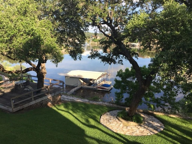 exterior space featuring a yard and a water view