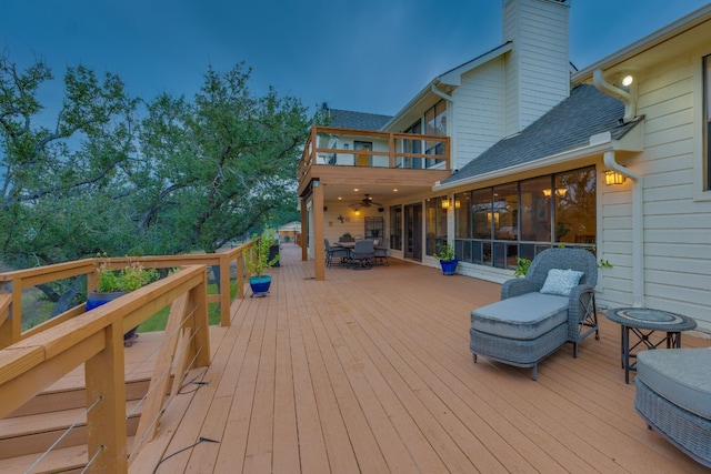 wooden terrace featuring a sunroom