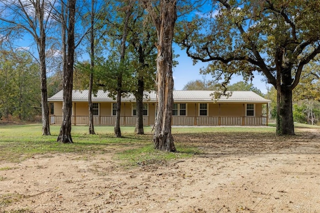 view of front facade with a porch and metal roof